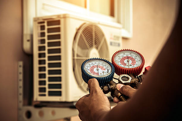 Professional Hvac technician working in Medford, MA